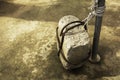 Stone tied to a iron pole on old cement Royalty Free Stock Photo