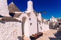 Stone tiles cover the roofs of the trulli in Alberobello, an Italian city to visit on a trip to Italy