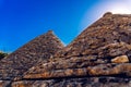 Stone tiles cover the roofs of the trulli in Alberobello, an Italian city to visit on a trip to Italy