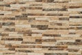 Stone tiles on the wall. The wall is made of ceramic  granite tiles. The structure of the stone. Royalty Free Stock Photo