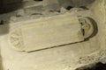Stone tomb lid with inscriptions and figurine in the crypt of Abbaye St-Victor, Marseille, Bouches-du-Rhone, Provence-Alpes-Cote d