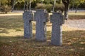 Stone tombstones in the German cemetery in the fall. Beautiful German cemetery near Kyiv. Many dead German soldiers of the dead Royalty Free Stock Photo