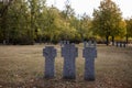 Stone tombstones in the German cemetery in the fall. Beautiful German cemetery near Kyiv. Many dead German soldiers of the dead Royalty Free Stock Photo