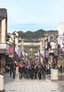 Stone torii gates with a group of Japanese college students in Dazaifu Tenmangu Sando Shopping street.