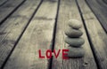 Stone tower and love on wooden floor