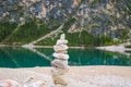 Stone tower made by tourists by the lake Royalty Free Stock Photo