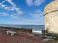 Stone tower by the sea, old protective structure of the tower guarding Royalty Free Stock Photo