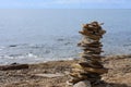 Stone tower on the seashore. Meditation