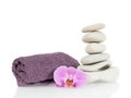 Stone tower with towel and orchid flower Royalty Free Stock Photo