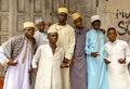 Stone Town street, Zanzibar, Tanzania. Local youth take photo on