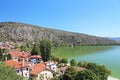Stone traditional houses and lake Orestiada in Kastoria