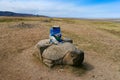 Stone turtle with sacred hadags or khadags blue silk scarves close to Erdene Zuu Khiid Monastery, Kharkhorin, Mongolia