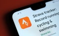 Strava tracker app seen on the corner of mobile phone