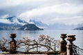 Stone vases on pedestals on a terrace above Lake Como. Villa Monastero, Italy Royalty Free Stock Photo