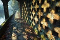 Stone walkway next to historic building with geometric pattern, covered in leaves Royalty Free Stock Photo