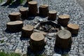 Stone walkways through a nature park made of irregular pieces. There are scabs on the pavement and around there are logs on which Royalty Free Stock Photo