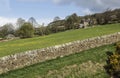 Stone wall above upper houses at Pateley Bridge,North Yorkshire, England, UK.