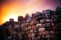 Stone wall against a vibrant sunset sky