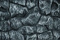 Stone wall background - building feature. Texture of thick and strong wall of rough stones of various shapes and sizes