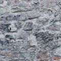 Stone wall background closeup, horizontal plastered grunge red grey beige stonewall limestone pattern, old aged weathered gray Royalty Free Stock Photo
