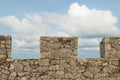 Stone wall with blue sky background Royalty Free Stock Photo