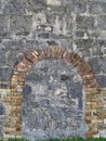 Stone Wall With Brick Arch Royalty Free Stock Photo