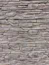 A stone wall of bricks of various shapes on the whole background Royalty Free Stock Photo