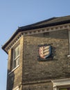 Stone wall carvings on the side of a building in Ipswich