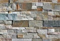 Stone wall cladding made of natural rocks bricks with different sizes and colors Royalty Free Stock Photo