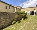 Stone wall dividing the courtyard at the Poder Spedalone near Montepulciano, Italy. Royalty Free Stock Photo