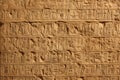 Stone wall with Egyptian hieroglyphs, Ancient hieroglyphic writing background. Fiction view of inscription inside old temple.