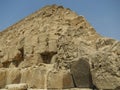 Stone wall of the Egyptian pyramid against the sky Royalty Free Stock Photo