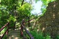 Stone wall fort wooden staircase backyard castle stairs nature trail hiking adventure rock wood steps