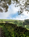 a stone wall on a grassy hill in the countryside of wales Royalty Free Stock Photo