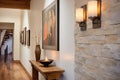 stone wall hallway with candle sconces