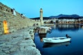 Stone wall and historic lighthouse in the port of Rethymnon