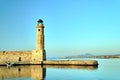 Stone wall and historic lighthouse in the port of Rethymnon