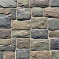 Stone wall with irregularly shaped stones in varying shades of gray Royalty Free Stock Photo