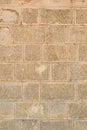 Stone wall with light beige blocks. vertical pattern solid hard background Royalty Free Stock Photo