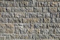 Stone wall made of square and rectangle rough granite blocks. Royalty Free Stock Photo