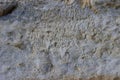 Stone wall with a multilayered old tumbling whitewash texture Royalty Free Stock Photo