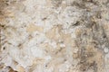 Stone wall with a multilayered old tumbling whitewash texture Royalty Free Stock Photo