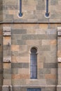 Stone wall and narrow window of the ancient castle Royalty Free Stock Photo