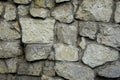 Stone wall natural gray green boulders with cement ties Royalty Free Stock Photo