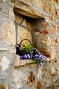 Stone wall niche with flowers