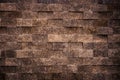 Stone wall of rectangular brown granite bricks as background. Royalty Free Stock Photo