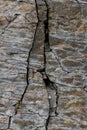 Stone wall of rock with cracks Royalty Free Stock Photo