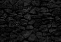 Black stone wall. Seamless texture
