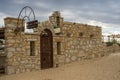 Stone wall and rusty wrought iron door on the beach, Villa Chinka, Varna, BUlgaria