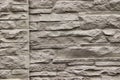stone wall. multilayer wall of flat stones, structure in beige tones